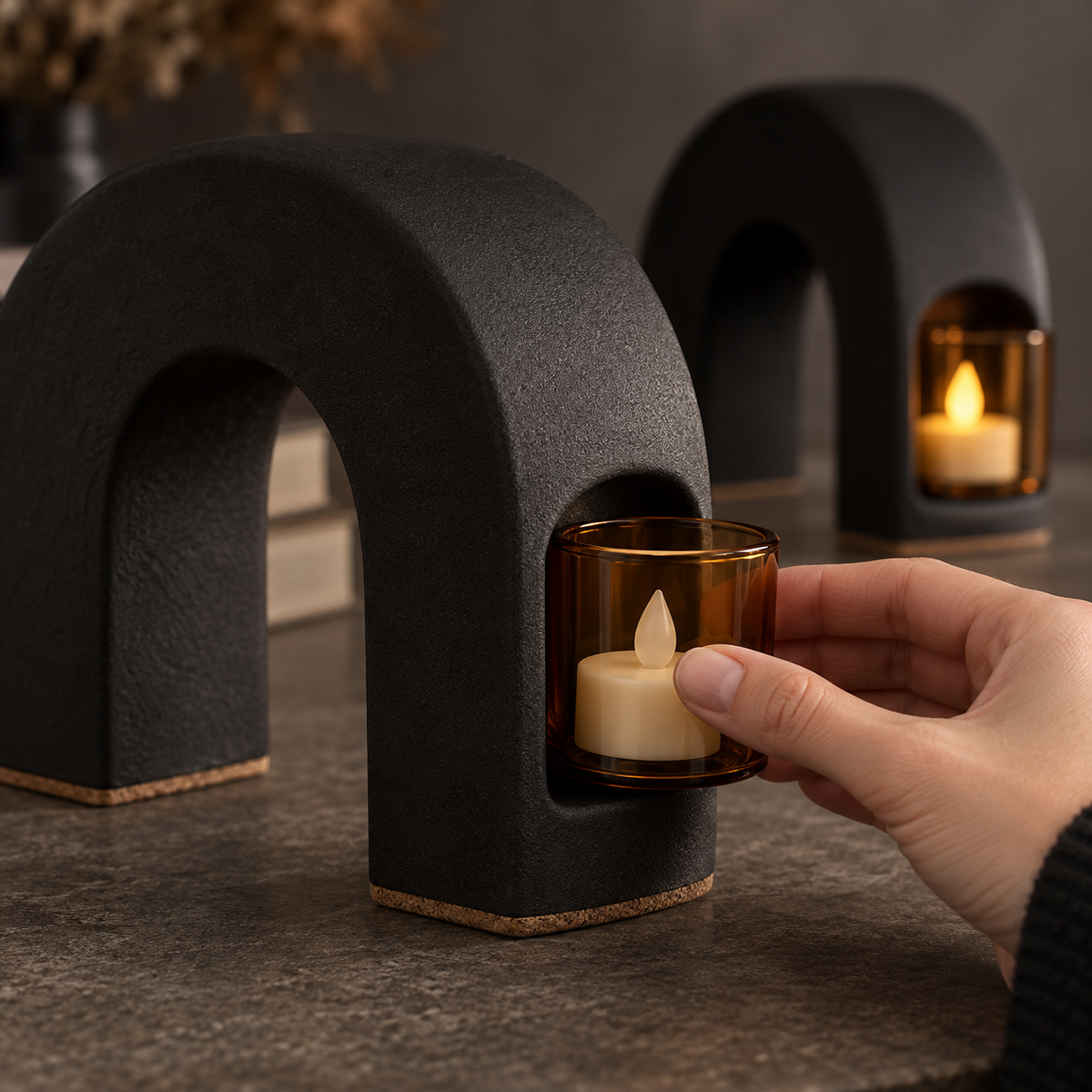 Candlepass Tealight Arch Bookends - detail hand sliding amber glass votive into arch side pocket
